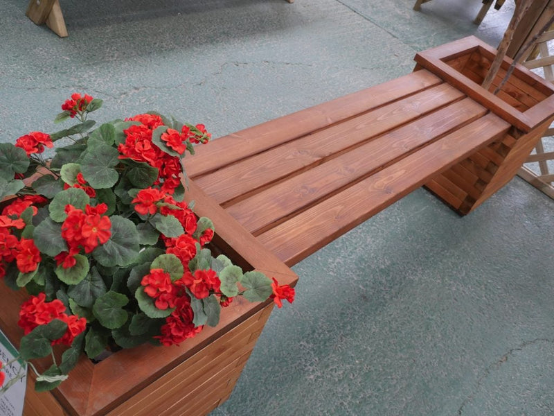 Planter bench with red flowers