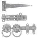 A set of metal gate hardware including a pair of medium tee hinges, a pad bolt, a ring latch, and additional mounting accessories.